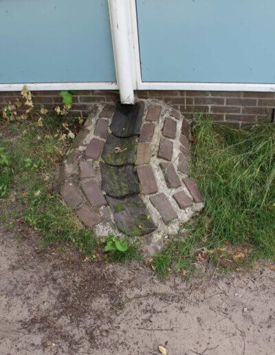 afkoppelen regenwater in natuurlijke tuin